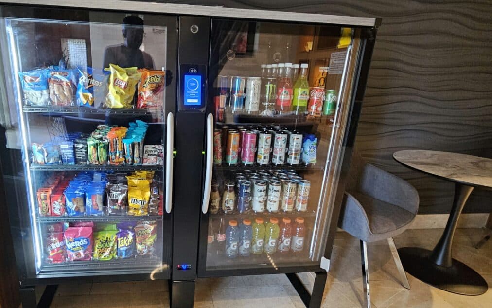 Smart cooler beside café seating in a building lounge