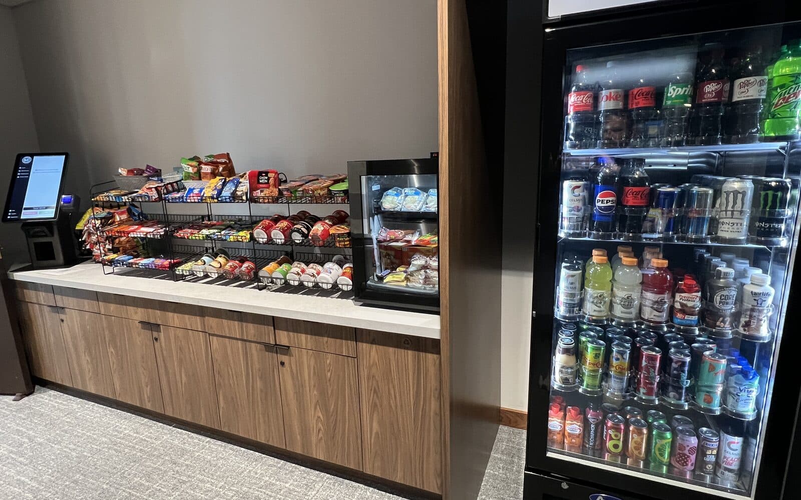 Self-checkout counter market and a stocked drinks cooler
