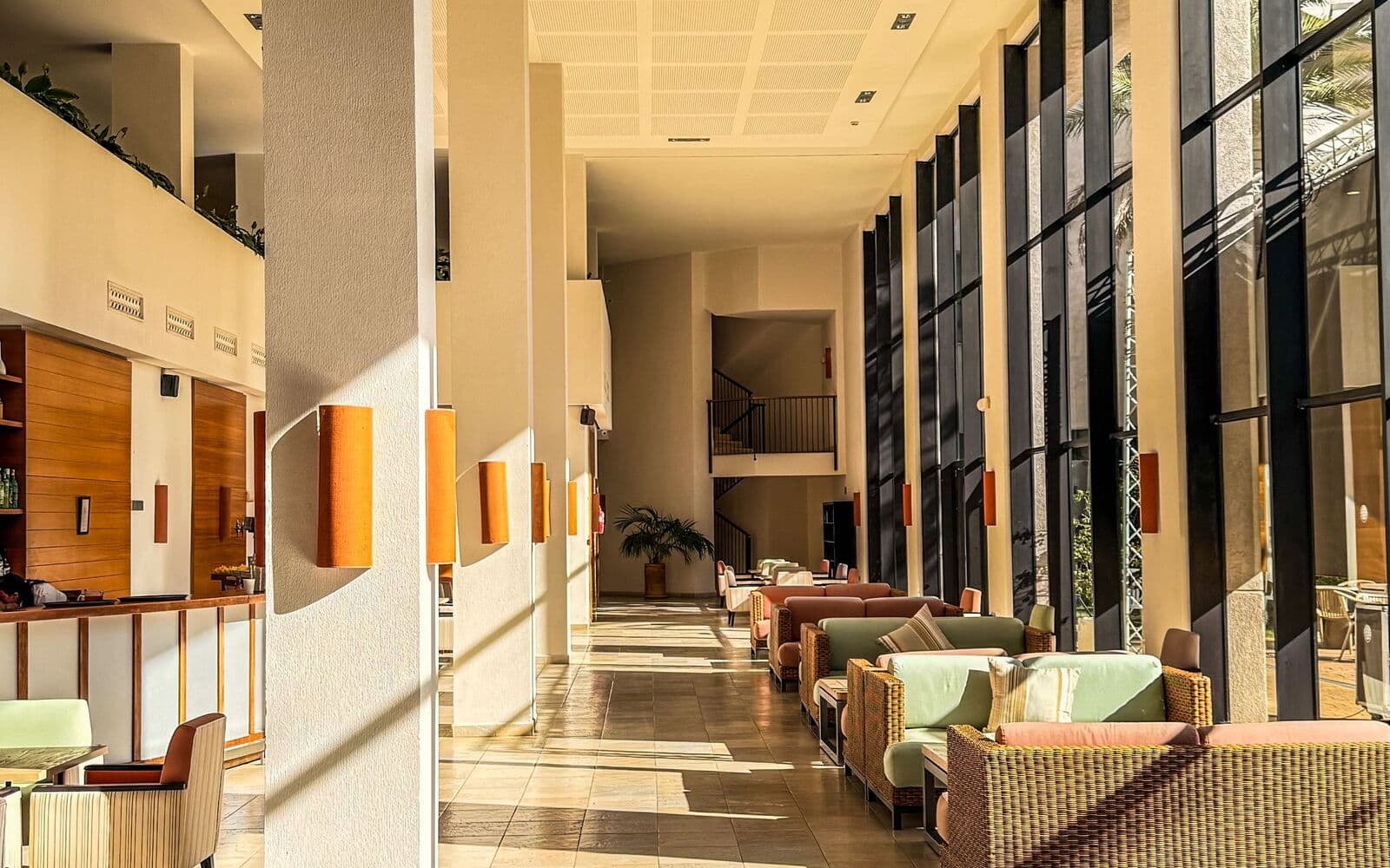 Hotel lobby lounge with seating and a lit grab-and-go market